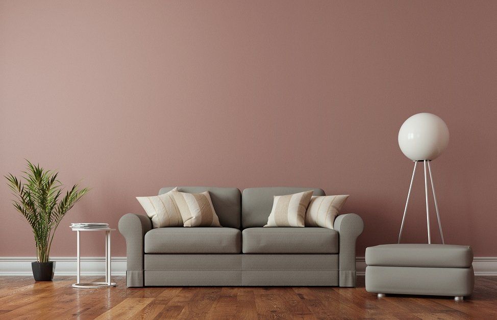 A living room with a freshly painted wall and a neat interior design in Hobart TAS.